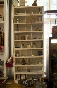 Compartments hold a variety of found objects